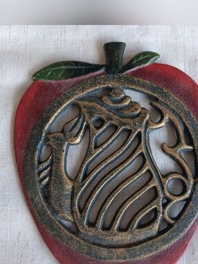 Vintage Cast Iron Apple Trivet With Teapot And Bird Design.  7"H X 6"W